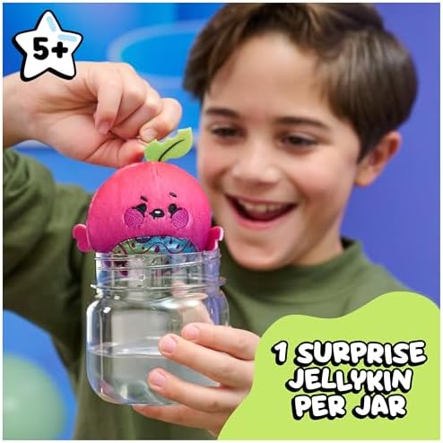 A child lifting a pink berry friend out of an opened jar